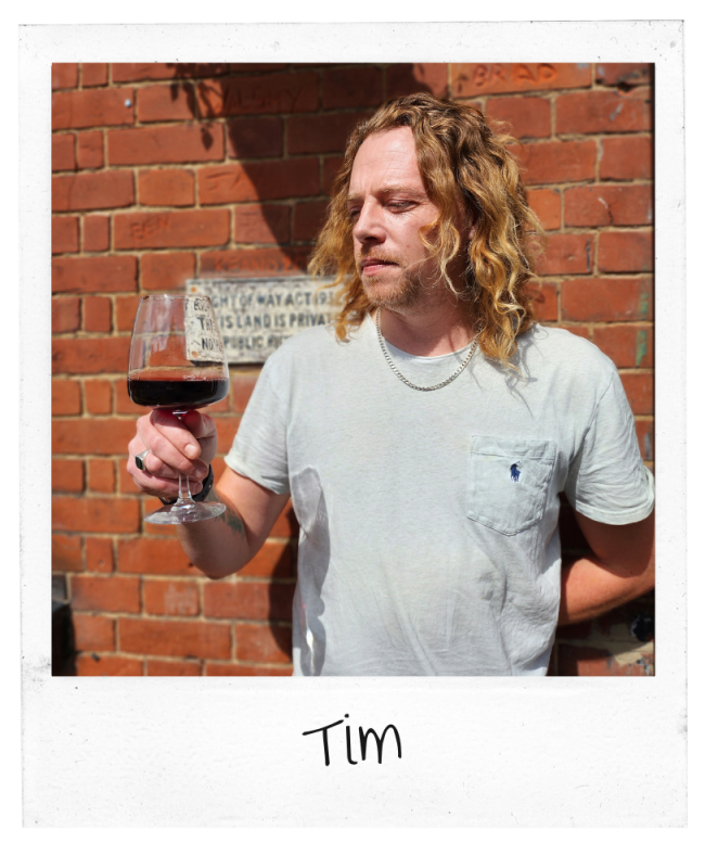 Tim Dodd holding a drink of beer outside The Rosebery pub