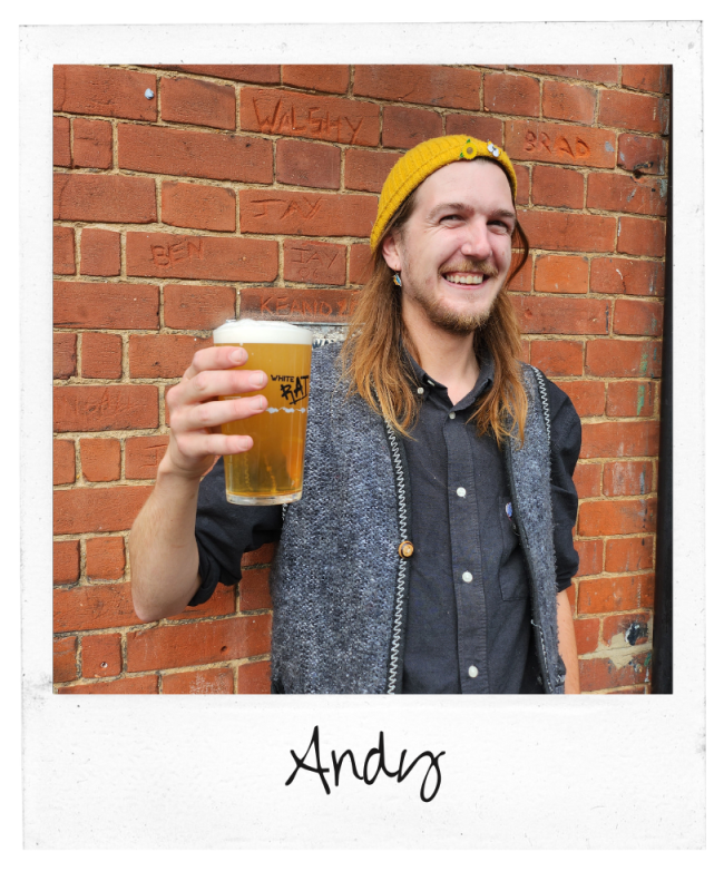 Bar staff member Andy holding a pint of beer outside the Rosebery pub